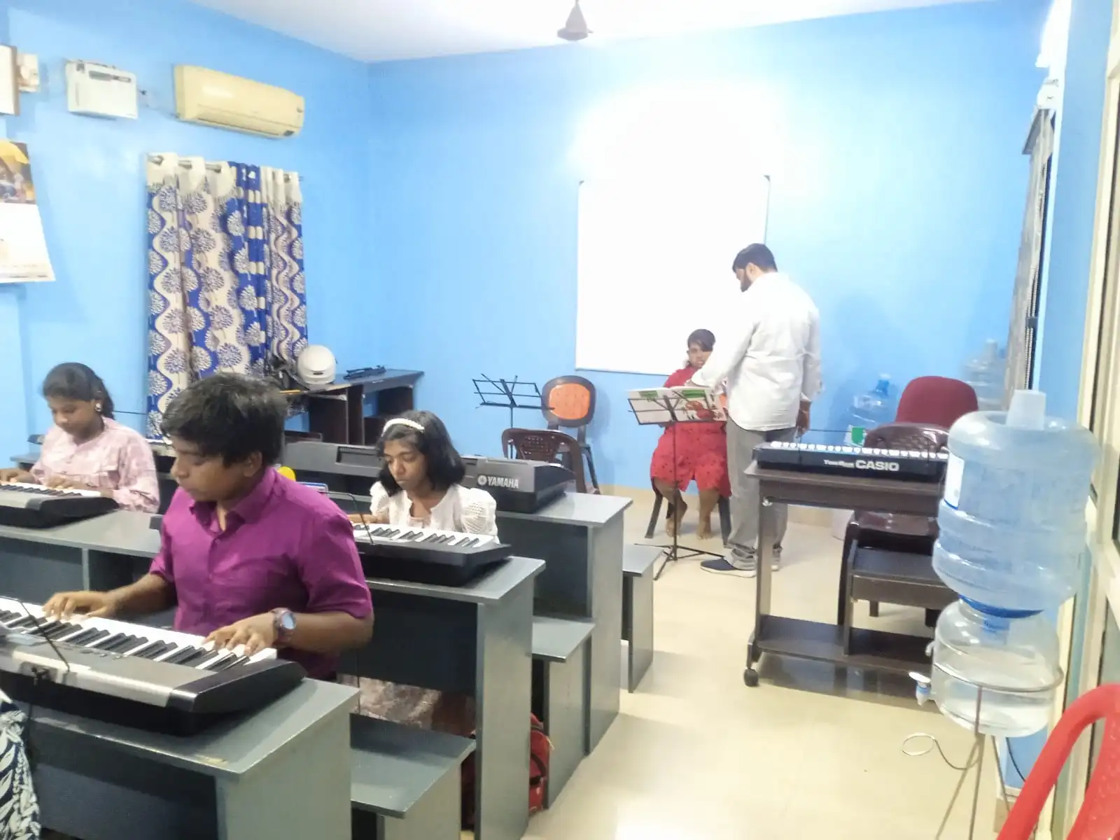Carnatic music teacher training students in Chennai